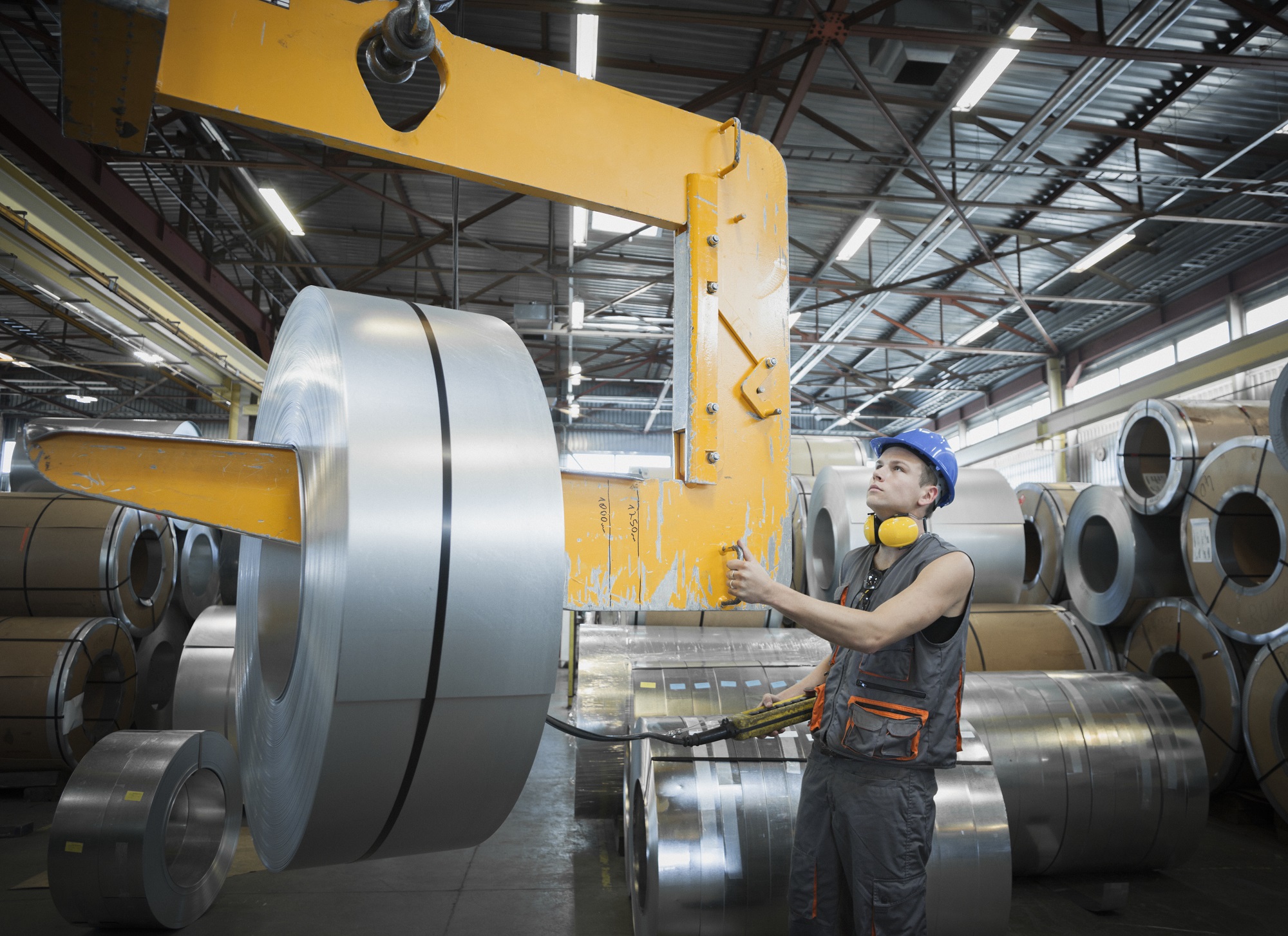 industrial worker in sheet metal component factory